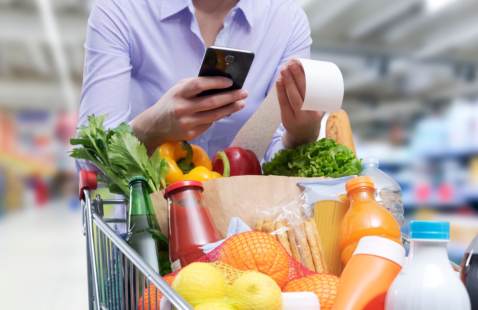 Woman checking the grocery receipt